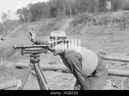 Instrument man working on new construction bridge at Norris Dam, Tennessee, 1933. Stock Photo