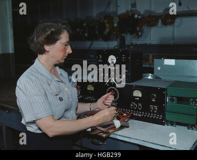 Woman working with the electric wiring at Douglas Aircraft Company, 1942. Stock Photo