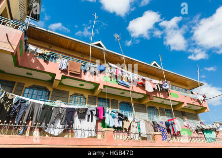 Typical colorful appartment building in Tassia, a residential district in the east of Nairobi, Kenya with laundry drying on the balconies. Stock Photo