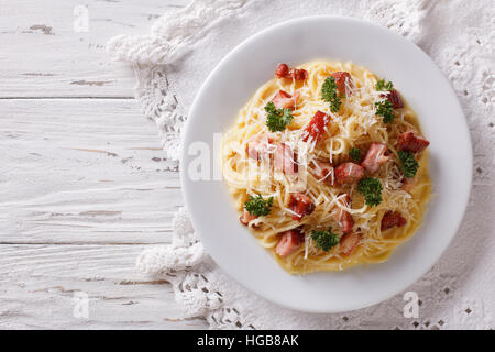 Italian food: pasta carbonara on the table. horizontal view from above Stock Photo