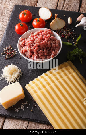 Recipe for classic Italian lasagna close-up on the table. vertical Stock Photo