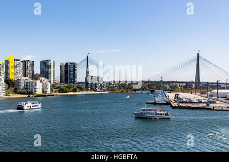 Boats in Sydney Harbour with Anzac Bridge in background Stock Photo