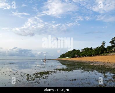 Early morning reflections on beach in Bali Stock Photo