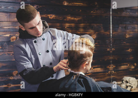 Little Boy Getting Haircut By Barber Stock Photo