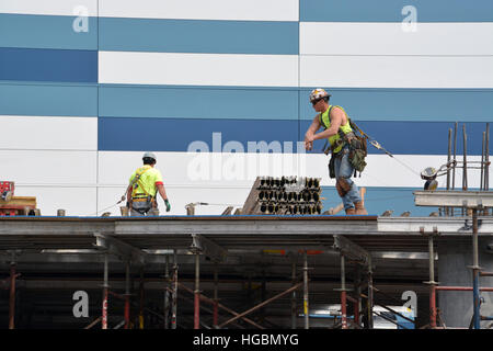 A construction worker helps ready the 2nd floor of a new building being built in Chicago's West Loop. Stock Photo