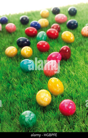 Coloured Easter eggs on a green meadow Stock Photo