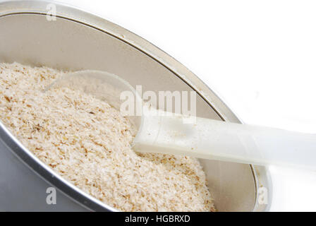 Psyillium seed husks. A dietary fiber supplement that is mixed with water. Stock Photo