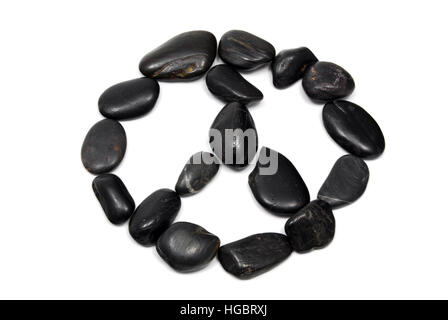 Natural peace sign made of rocks on a white background. Stock Photo