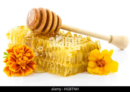 Fresh honey with honeycomb and flowers isolated on white background Stock Photo