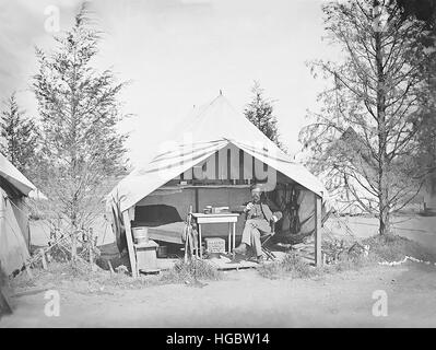 Lieutenant James B. Neill sitting inside his tent during the American Civil War. Stock Photo