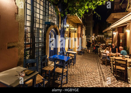 Alleyway in the old town restaurant with tables seating area, Chania, Crete, Greece Stock Photo