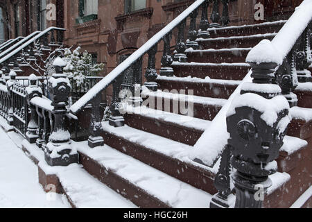 Brooklyn Heights brownstone townhouse front stoop in a winter snowstorm Stock Photo
