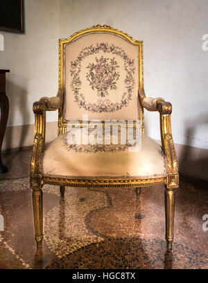 Vintage luxury white and golden armchair isolated. Stock Photo