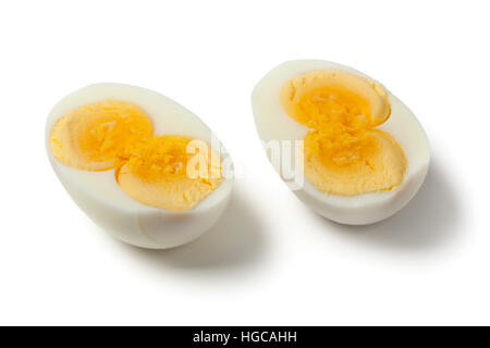 Peeled cooked double yolk egg on white background Stock Photo