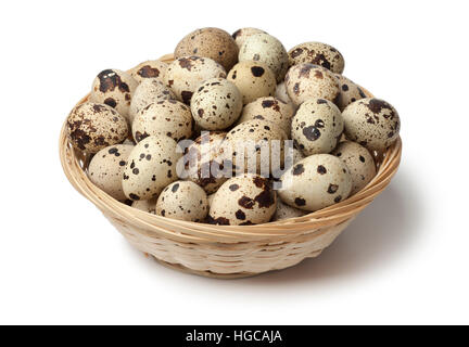 Basket with fresh raw Quail eggs on white background Stock Photo