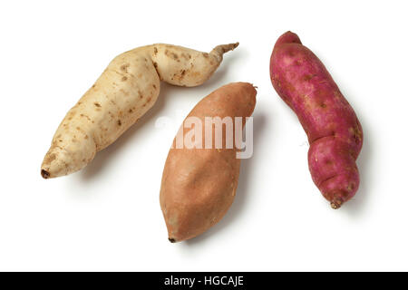 Purple, white and orange sweet potatoes on white background Stock Photo