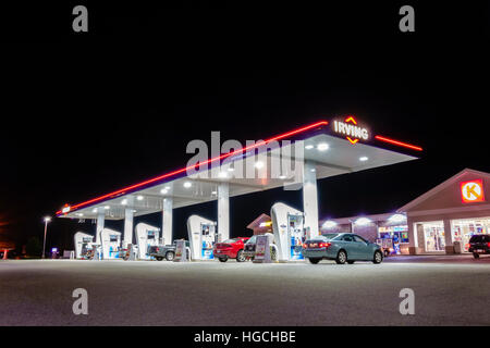 Irving gas station and Circle-K at night. petrol station, service station, filling station, pump at night. Open 24/7. Ellsworth Maine USA. Stock Photo