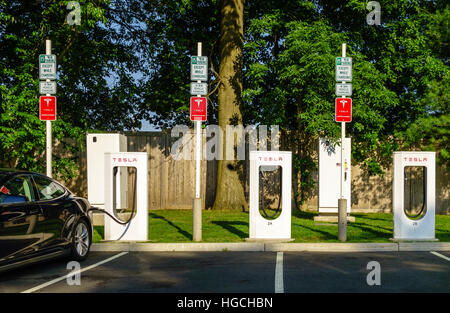 Tesla Supercharger Station on the Merritt Parkway in Greenwich, Conneticut, USA. Stock Photo