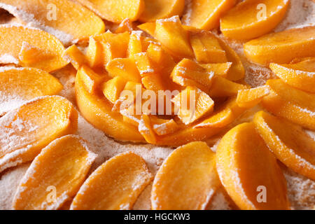 Delicious pie with cream cheese and persimmons macro. horizontal background Stock Photo