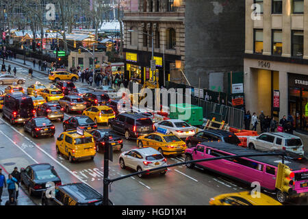 Traffic on 6th Ave near Bryant Park early evening, New York. Stock Photo