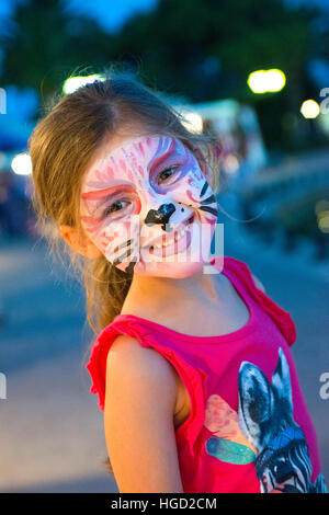 Happy young girl with face painting, Majorca, Balearics, Spain Stock Photo