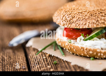 Fresh made cream cheese Bagel (selective focus; close-up shot) Fresh made cream cheese Bagel (selective focus; close-up shot)