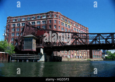 The 18th Street bridge and a century old brick warehouse on the South Branch of the Chicago River. Stock Photo