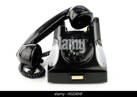 Old retro bakelite telephone. On a white background. Stock Photo