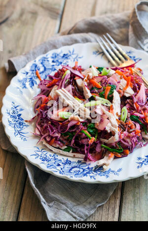 Salad with leftover turkey, red cabbage, apples and carrots Stock Photo