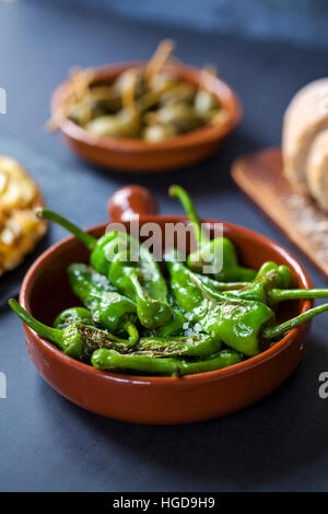 Authentic Spanish tapas with padron peppers Stock Photo
