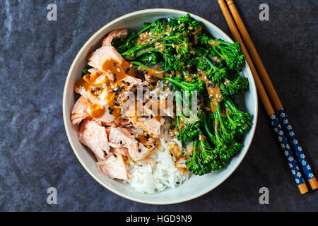 Poached salmon with rice, broccoli and miso sauce Stock Photo