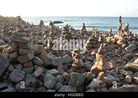 cairns on the coast in Skane Stock Photo