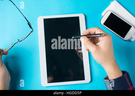 man hand a tablet device at the office Stock Photo