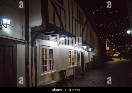 Mediaeval courtyard exterior of the Blue Boar pub at night, 14th. century, Maldon, Essex, England Stock Photo