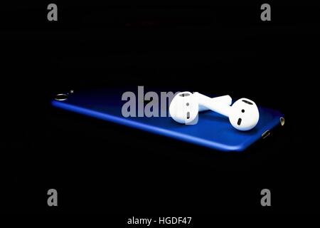 iPod touch with a pair of AirPods Stock Photo