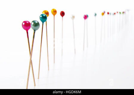 Fixing pins standing in a row Stock Photo