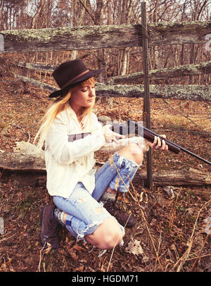 looking down the barrel of a shotgun while a female shoots clay Stock ...