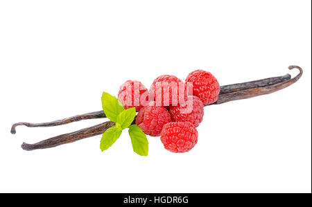 composition of vanilla pods with green leaves mint and red ripe raspberries isolated on white background, decoration for your product, close up Stock Photo
