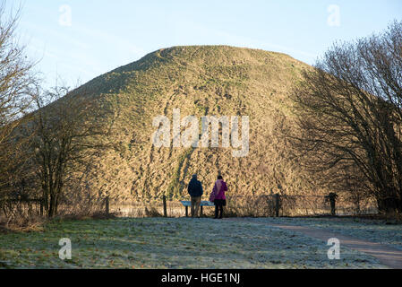 Visitors at the prehistoric Silbury Hill site near Avebury in Wiltshire England UK Stock Photo