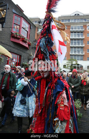 London, UK. 8th Jan, 2017. The Bankside Mummers celebrate Twelfth Night on the south bank. The Epiphany is the traditional end to the christmas season and winter greenery was brought indoors to 'keep the green' and encourage a sense of the return of warmer months. Holly man was played by David Risley;, Beelzabub played by Michael Palmer and St George played by Connor Nolan. © SANDRA ROWSE/Alamy Live News Stock Photo