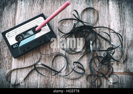roll audio tape pencil vintage background Stock Photo