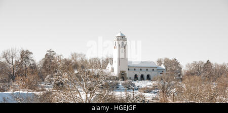 Train Depot in winter with clock tower and snow Stock Photo