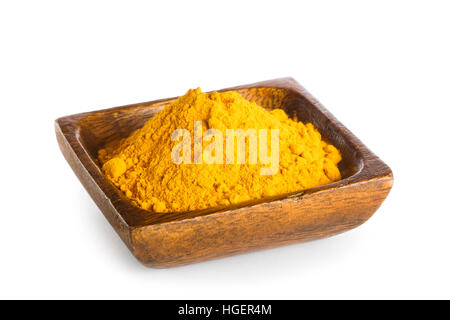 Turmeric powder in bowl isolated on white background Stock Photo