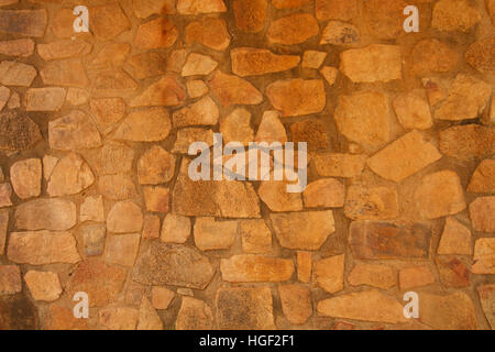 rustic old stone wall background Stock Photo