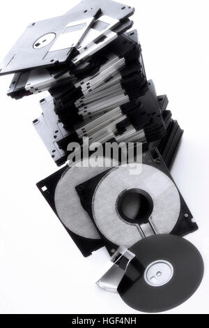 A stack of floppy disks, a broken one in the foreground Stock Photo