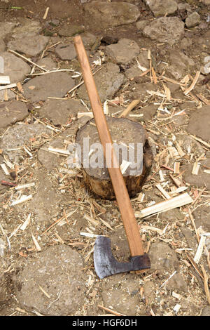 Axe used for splitting wood log Stock Photo