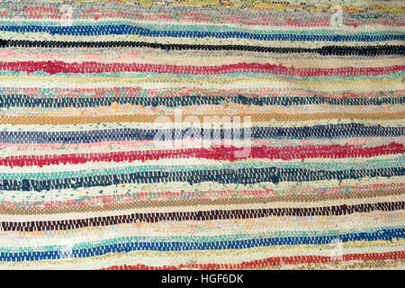 Old rural woven stripe carpet Stock Photo