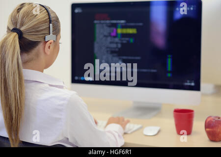 startup business, young woman as software developer working on computer at modern office Stock Photo
