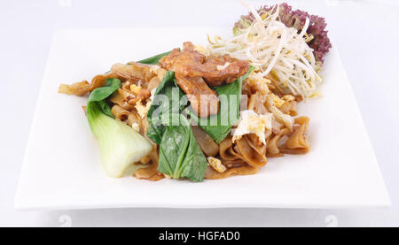Stir fried flat rice noodle chicken Thai foods Stock Photo