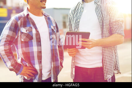 close up of builders with tablet pc outdoors Stock Photo